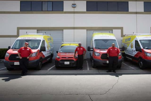 The Fix it Fast Plumbing Heating & AC Repair team standing by their trucks and ready for any emergency you may have.