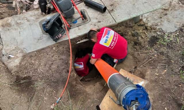 Fix It Fast plumbers repiping under a sidewalk.